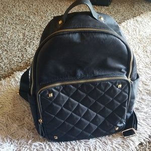 Black Quilted Purse with gold accents.